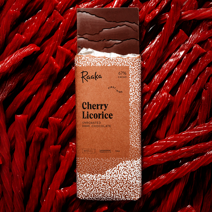 Raaka Cherry Licorice dark chocolate bar packaging on licorice ropes