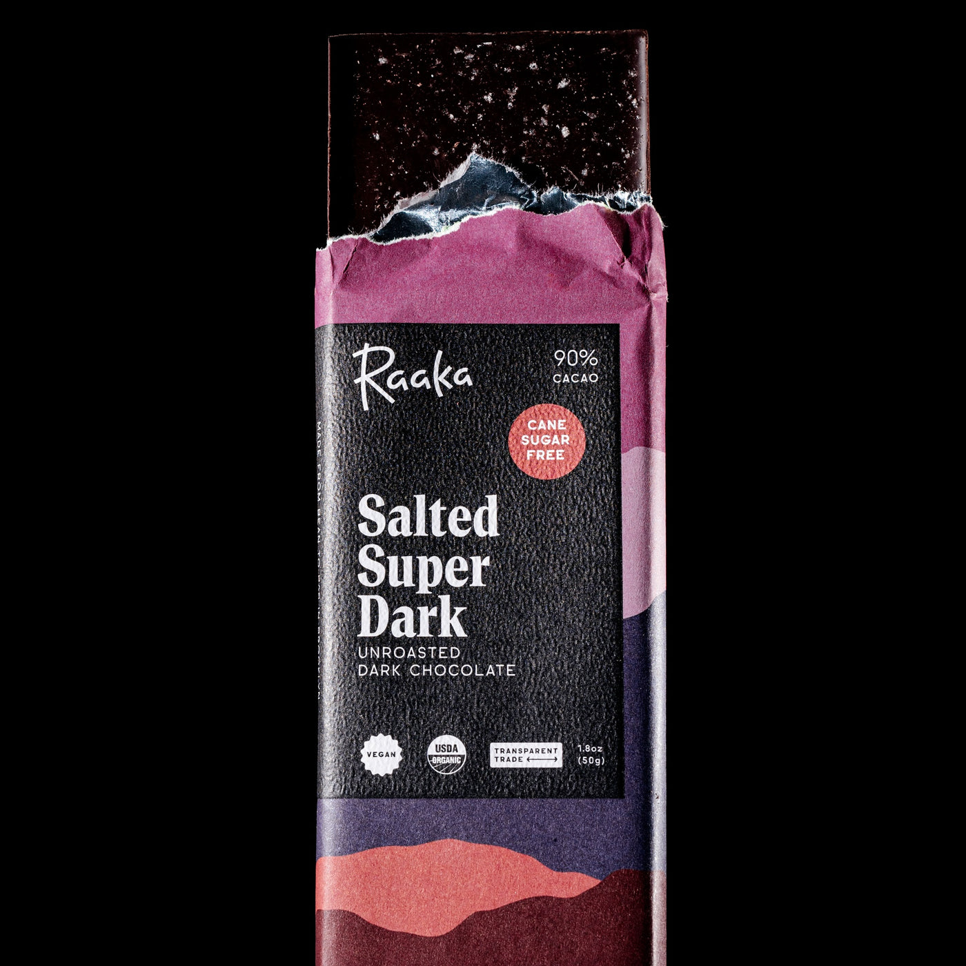 Raaka Salted Super Dark chocolate bar packaging on a black background