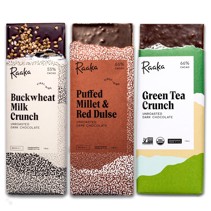 Three Raaka chocolate bars with different flavors and designs on a white background