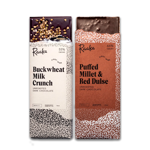 Two Raaka chocolate bars, one Buckwheat Milk Crunch and one Puffed Millet & Red Dulse, on a white background.