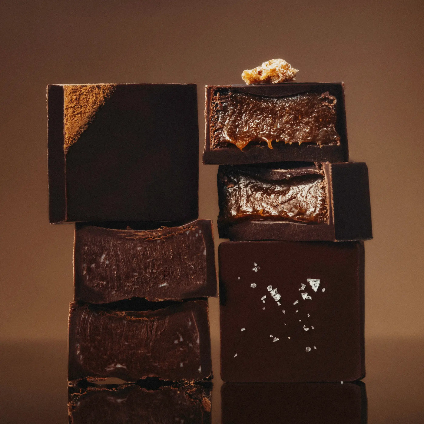 Stack of date-sweetened truffles with a brown background