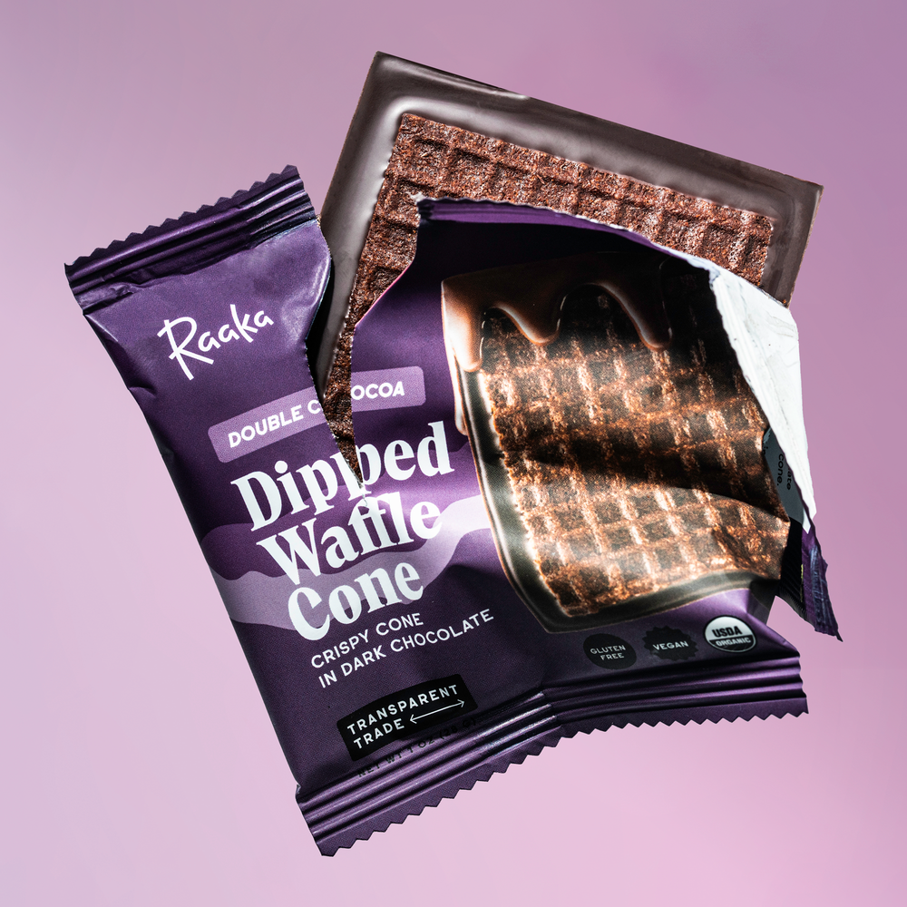Purple package of Raaka Dipped Waffle Cone with waffle cone visible on a purple background.