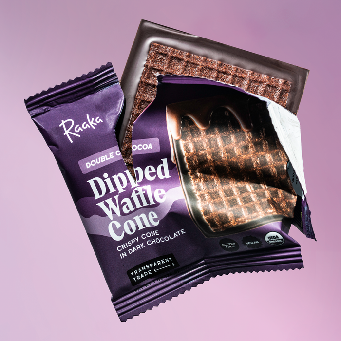 Purple package of Raaka Dipped Waffle Cone with waffle cone visible on a purple background.