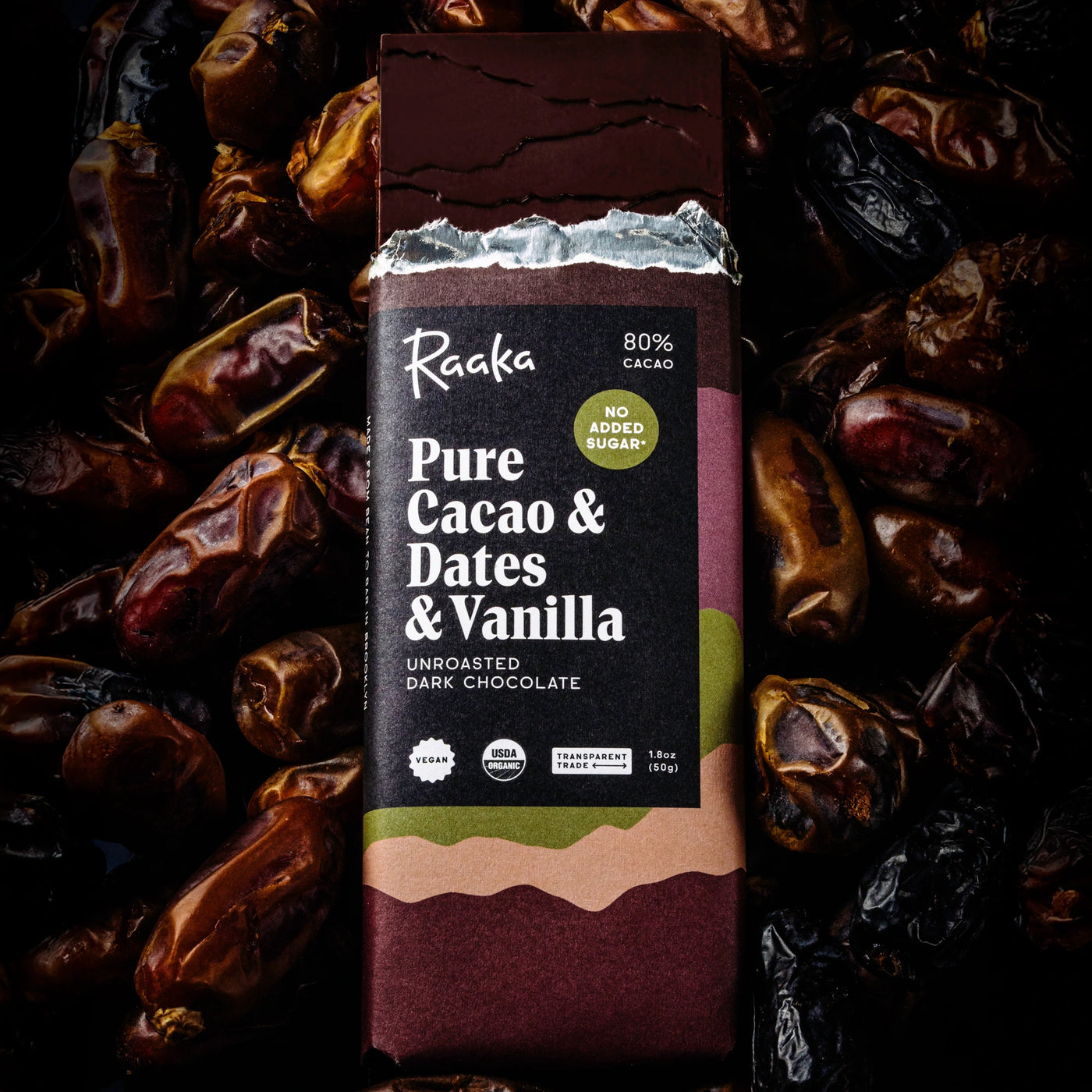 Raaka Pure Cacao & Dates & Vanilla chocolate bar packaging with dates in the background