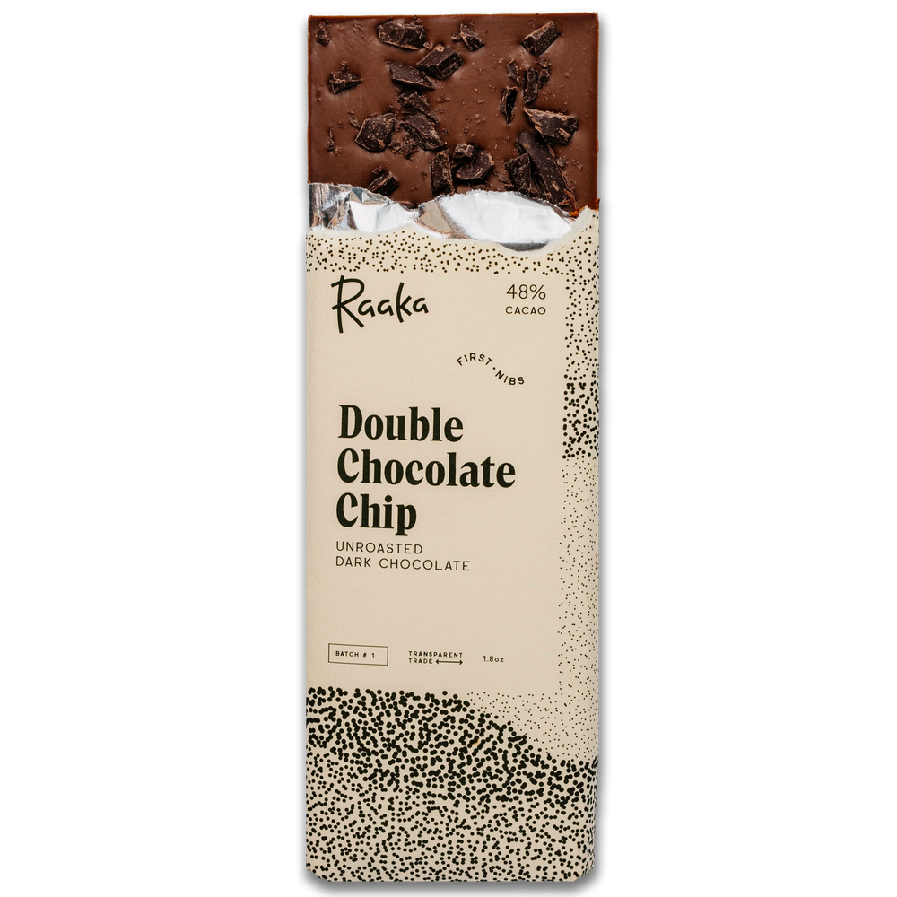A packaged double chocolate chip bar by Raaka, showing the top half of the chocolate bar and the printed wrapper with cream, black speckling, and dark chocolate imagery.