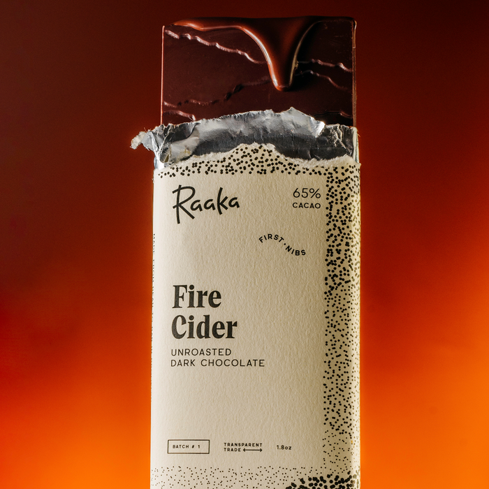 Fire Cider Bar with dripping chocolate on a red and orange radiant background.
