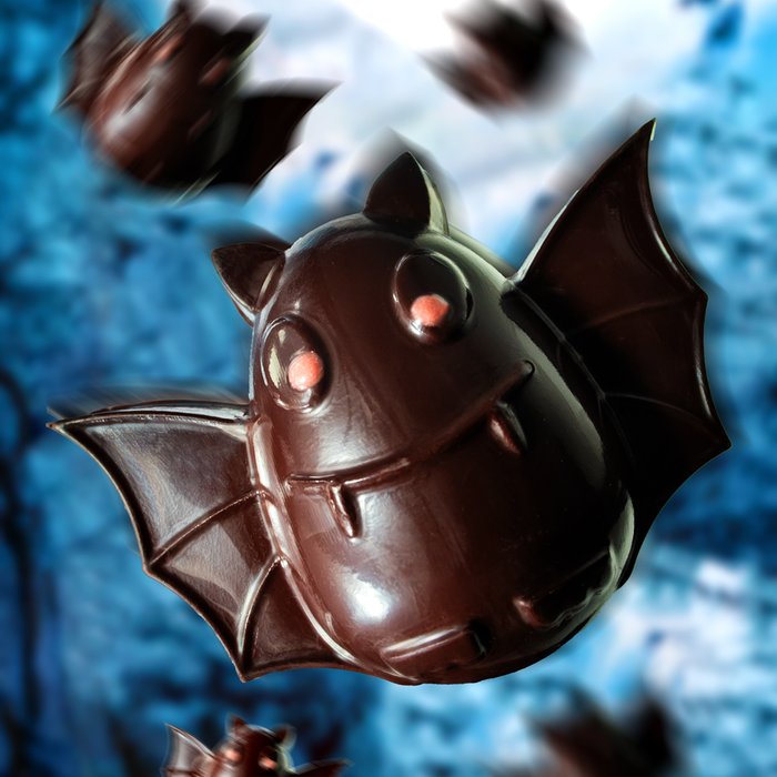Chocolate Fruit Bat flying on spooky background.