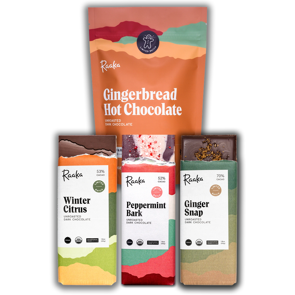 Collection of Raaka Chocolate products including Gingerbread Hot Chocolate, Winter Citrus, Peppermint Bark, and Ginger Snap on a white background.