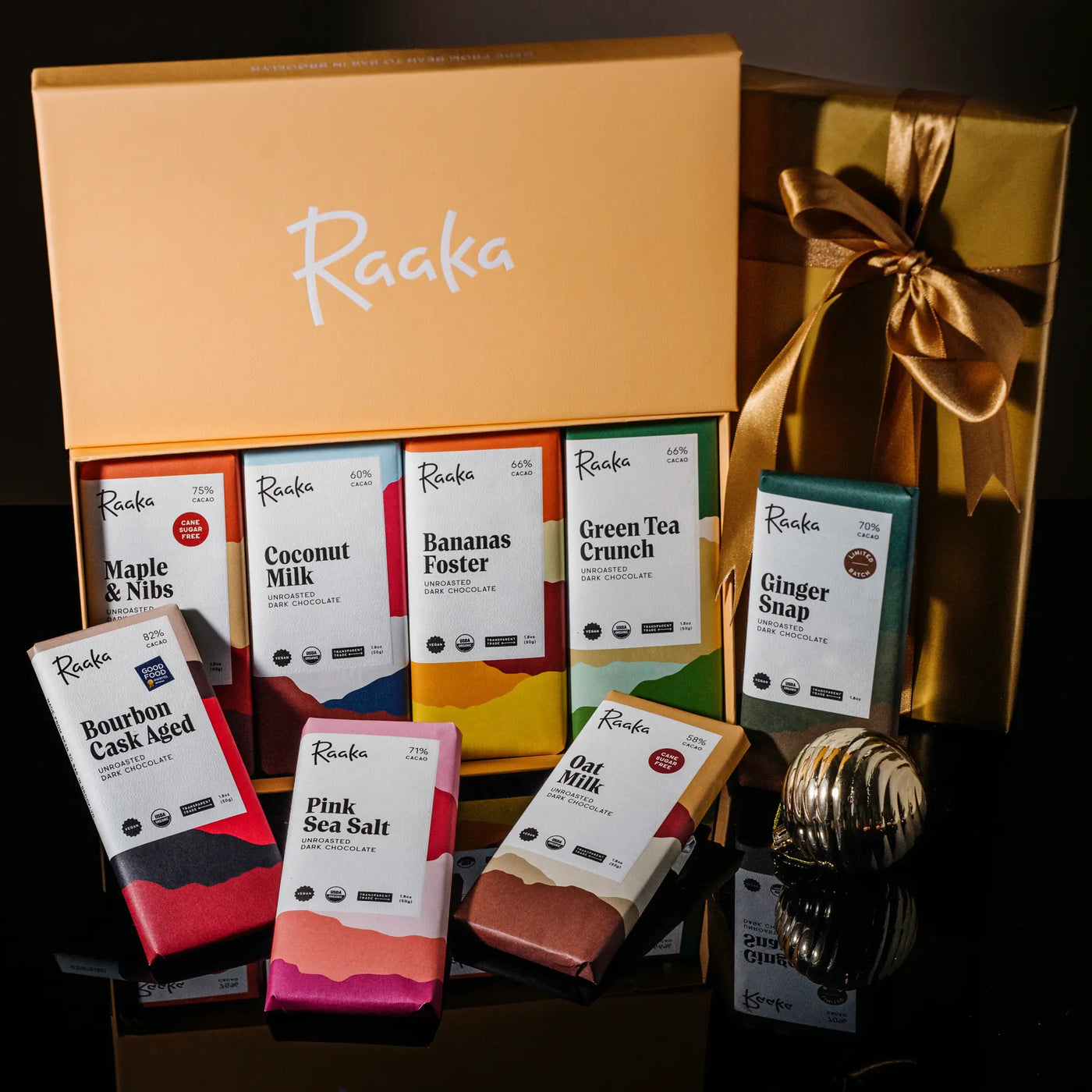 Raaka's Library Box collection of eight dark chocolate bars, opened to show interior.