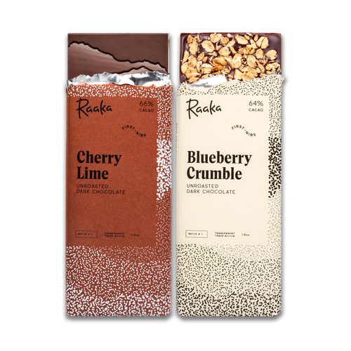 Two Raaka chocolate bars, one Cherry Lime and one Blueberry Crumble, on a white background.