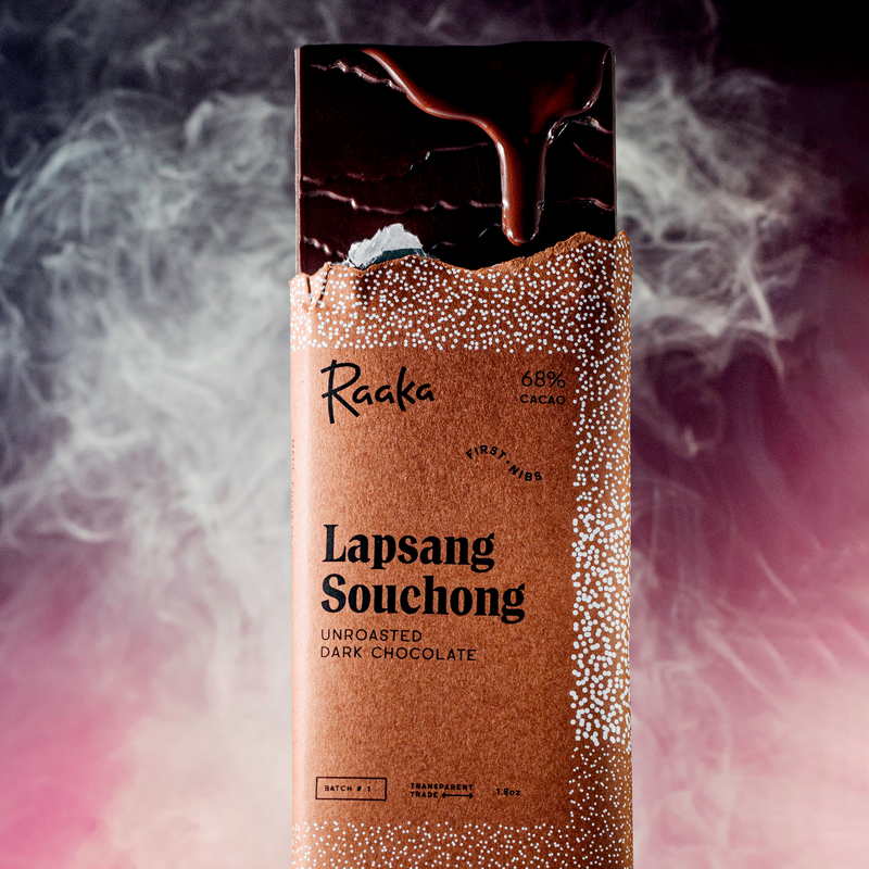 Lapsang Souchong bar with dripping chocolate and smoke behind it.