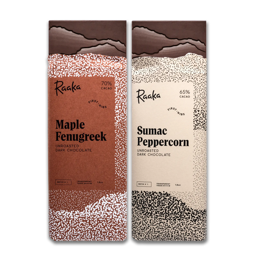 Two Raaka chocolate bars, one Maple Fenugreek and one Sumac Peppercorn, on a white background.