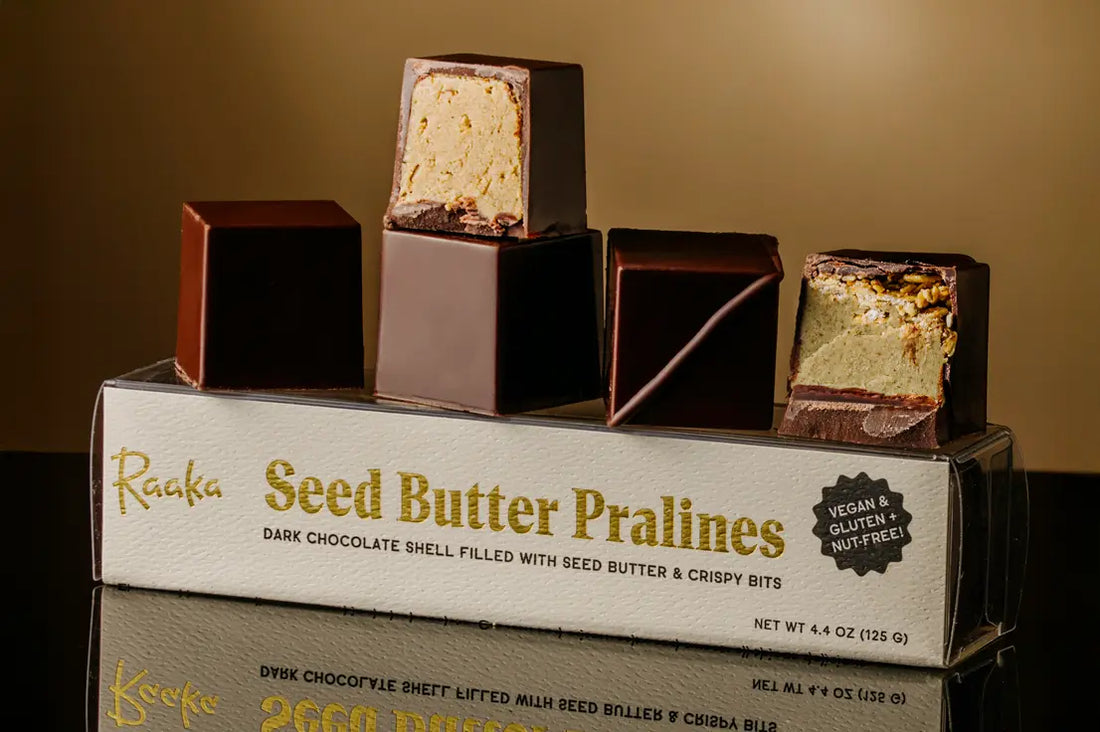Praline Cubes, some cut open to show centers filled with seed butter.