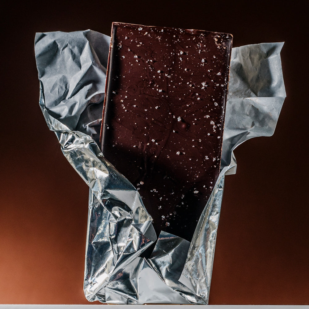 Dark chocolate bar with visible salt flakes