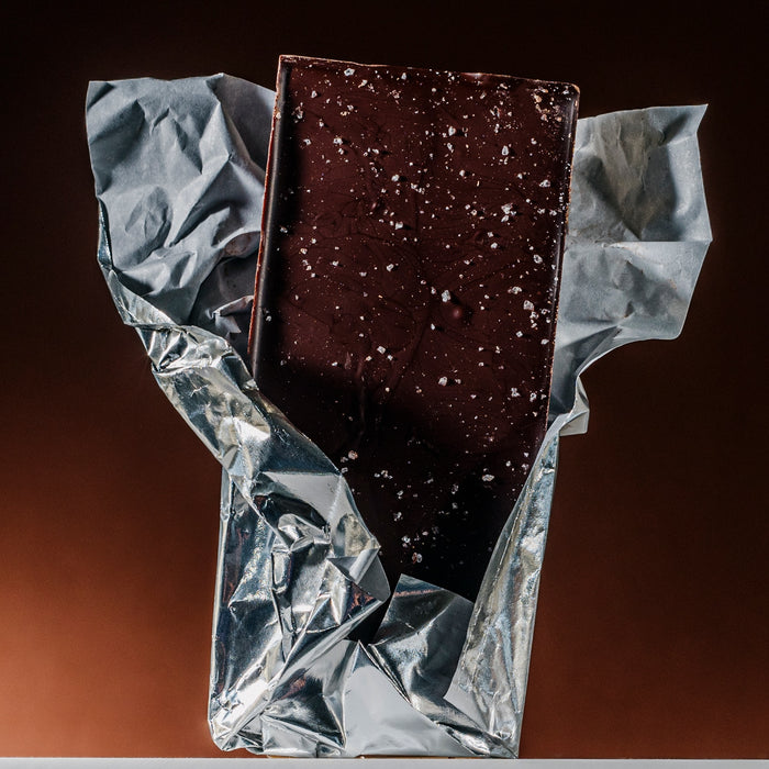 Dark chocolate bar with visible salt flakes