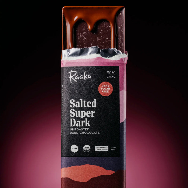 Raaka Salted Super Dark chocolate bar with a dark background