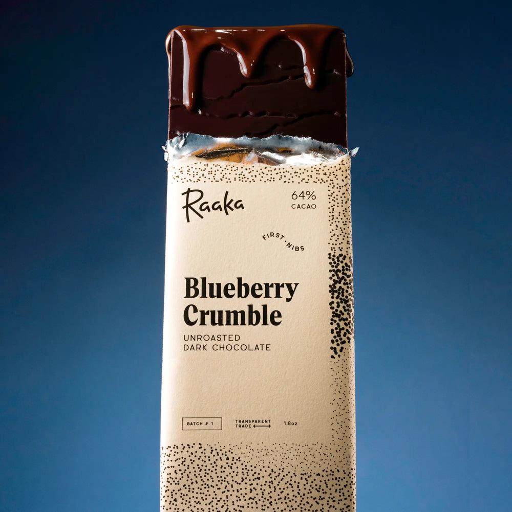 Blueberry Crumble popping out of wrapper with chocolate dripping down.